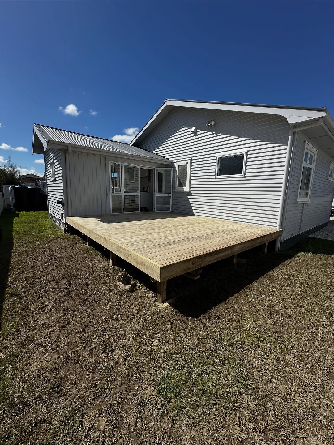 New treated pine deck in Hamilton finished with a penetrating deck oil, pale even colour